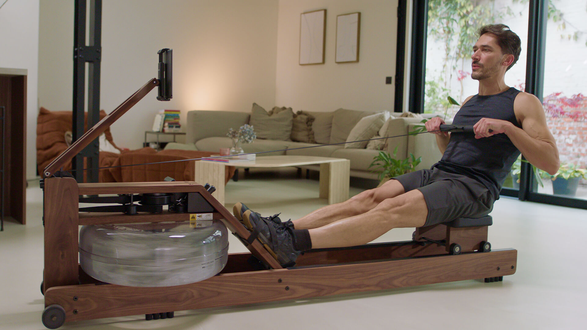 Man rowing on a WaterRower Performance with the EXR app.