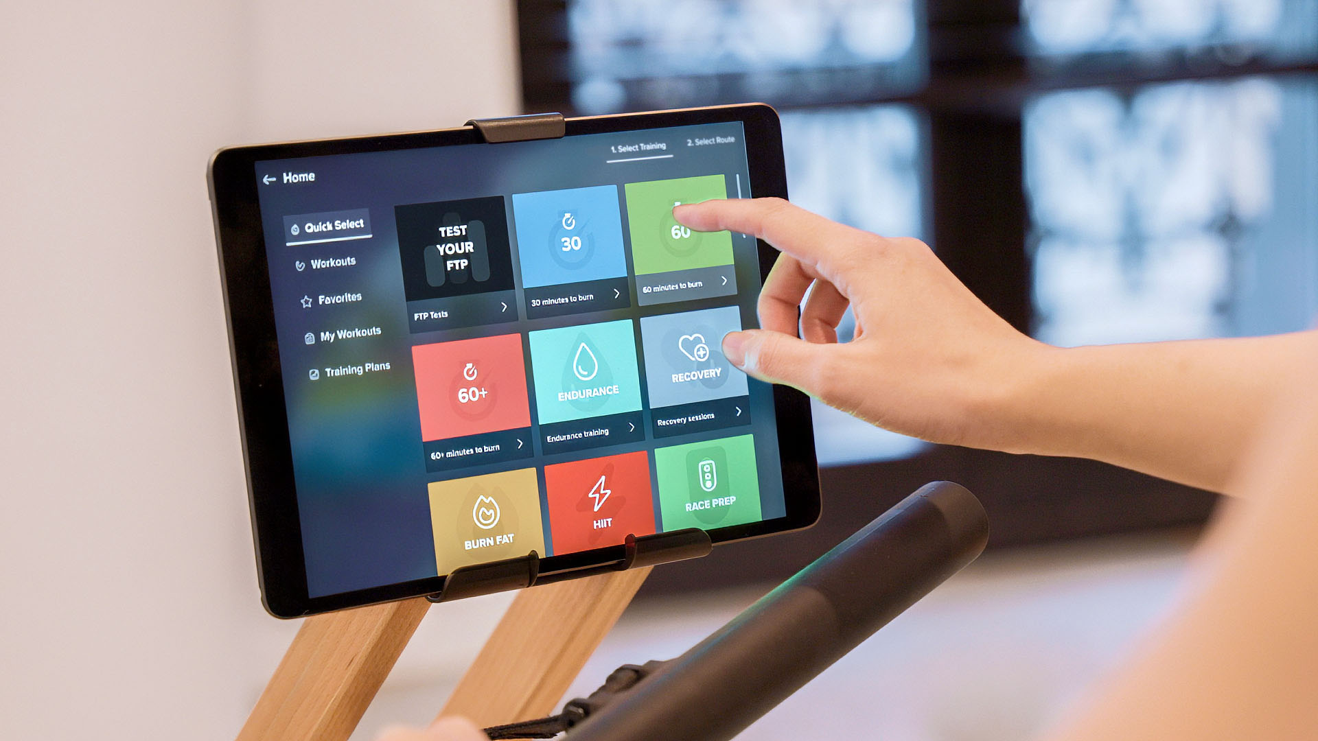 Person selecting workout category in the EXR rowing app