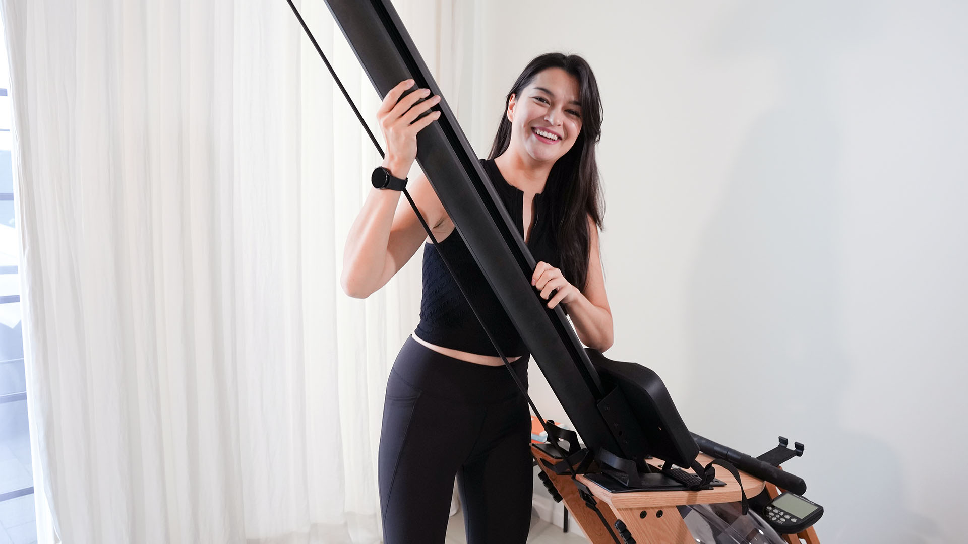 Woman setting up waterrower