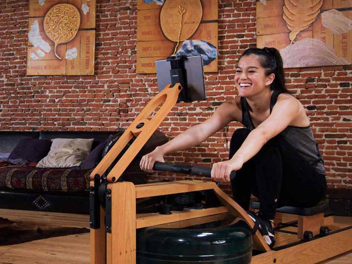 Woman training on rowing machine