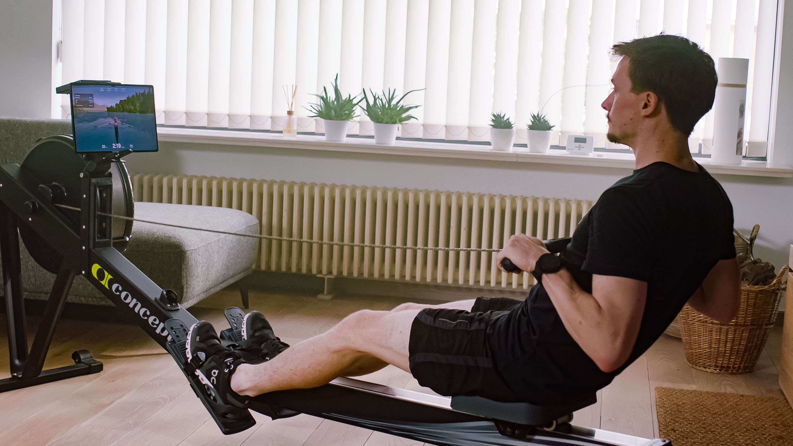 Man rowing on a concept2 rower with EXR
