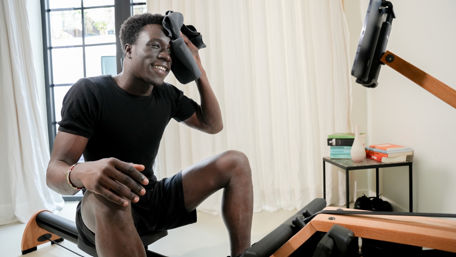 Man sweating on rowing machine