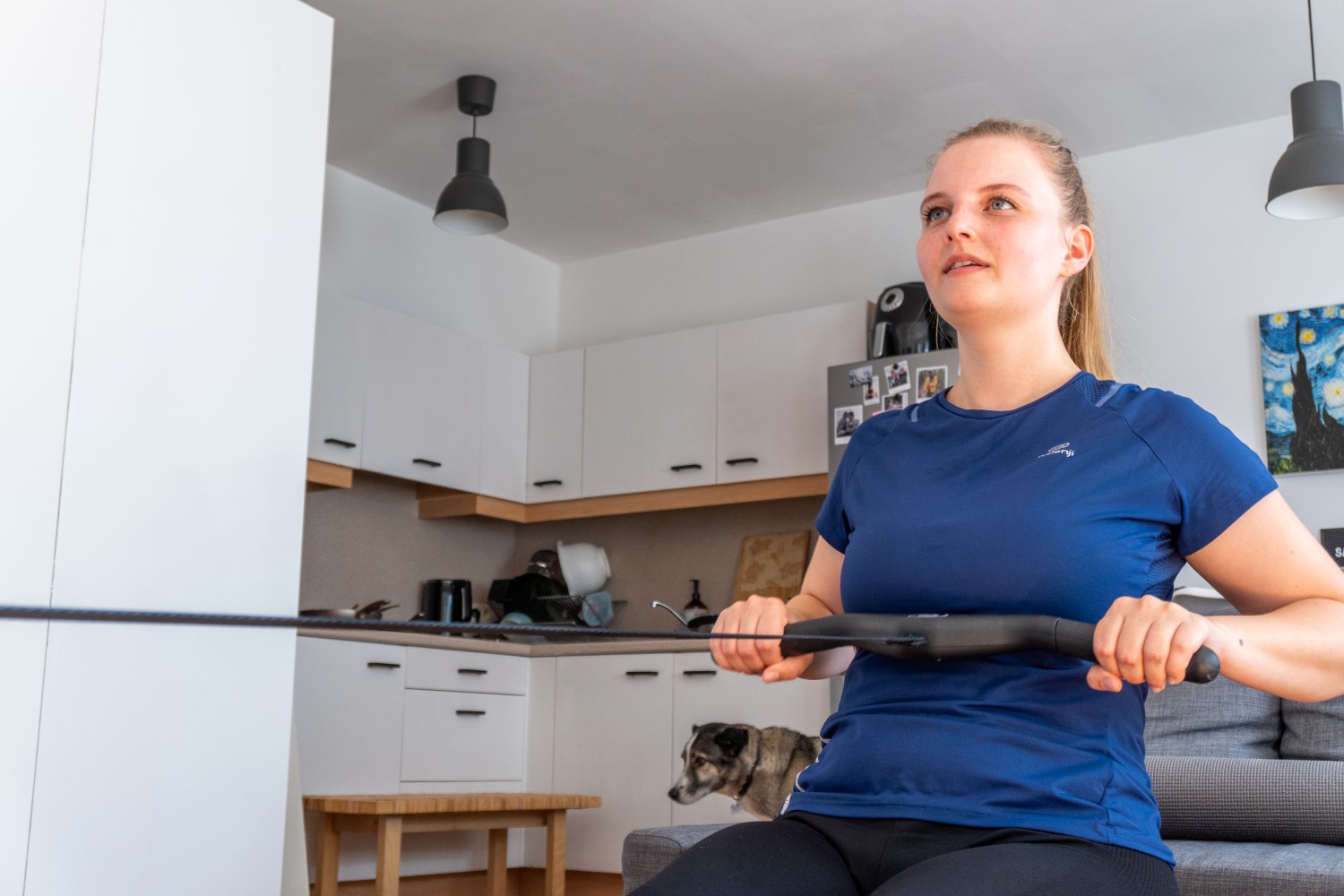 Woman on a rowing machine talking to herself to test her stamina.