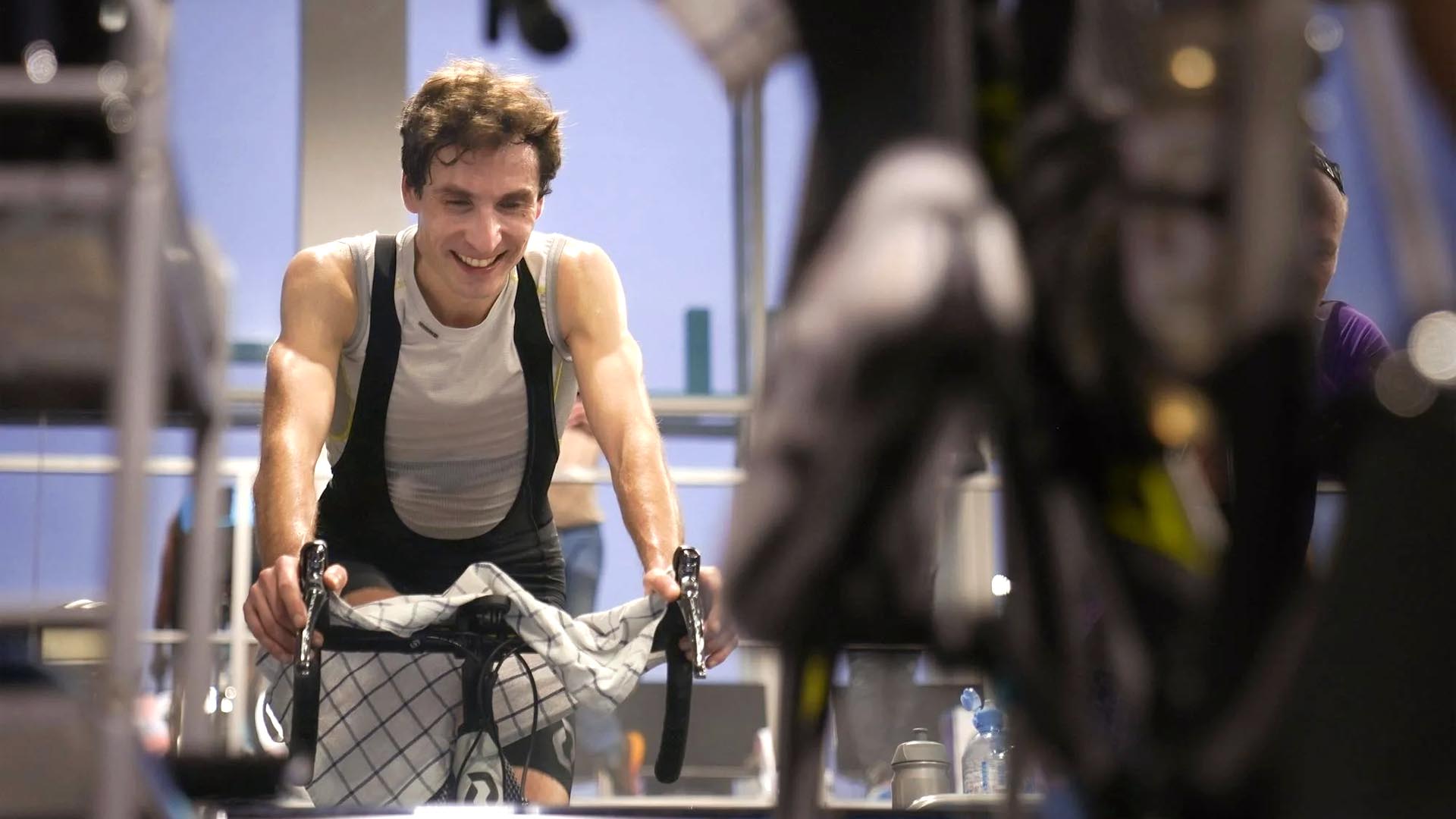 Man sweating on indoor bike.